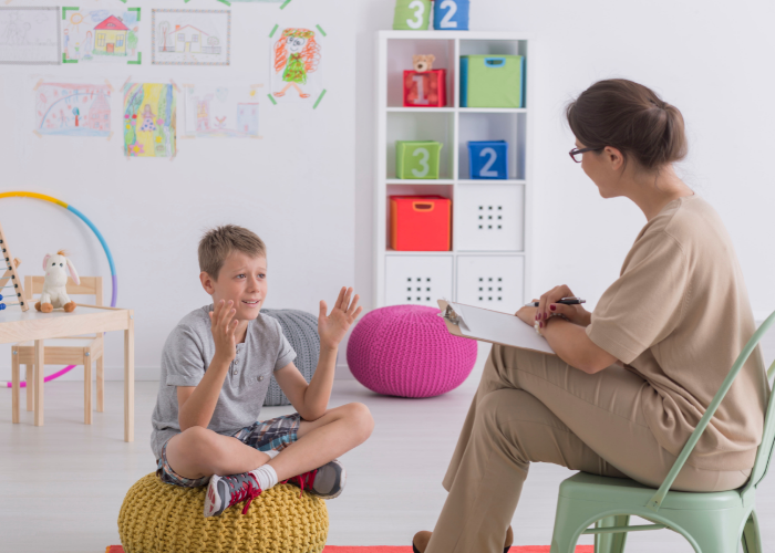 Child talking with child therapist.
